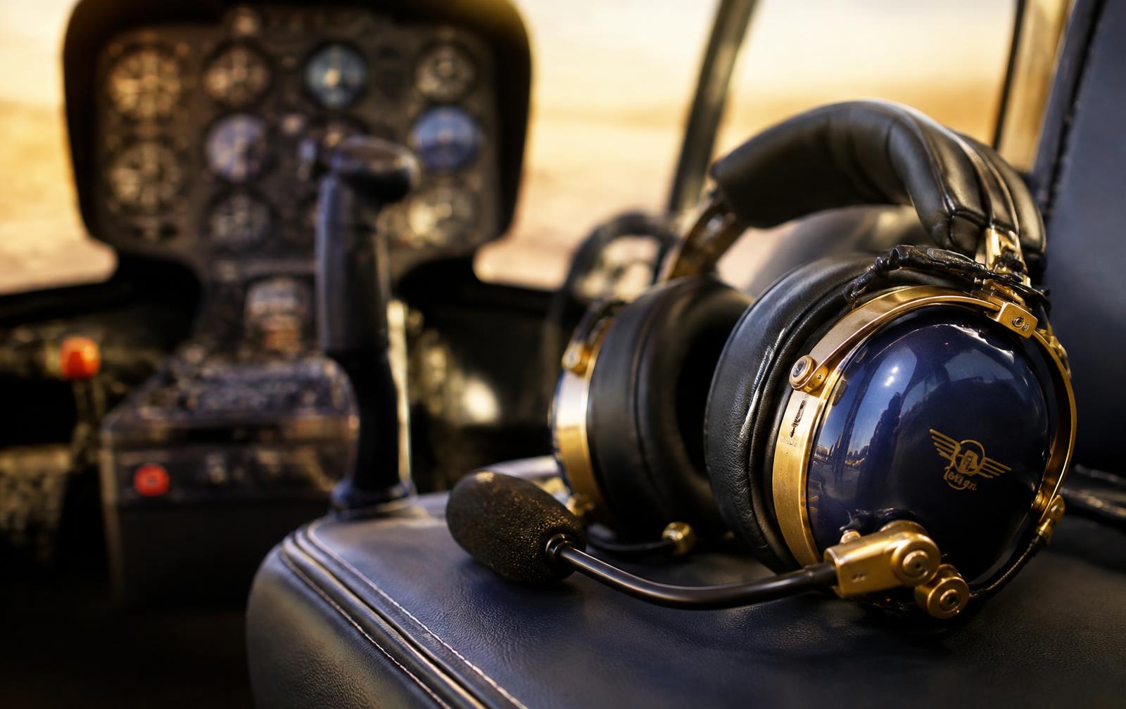 Aviation headset resting on a cockpit seat